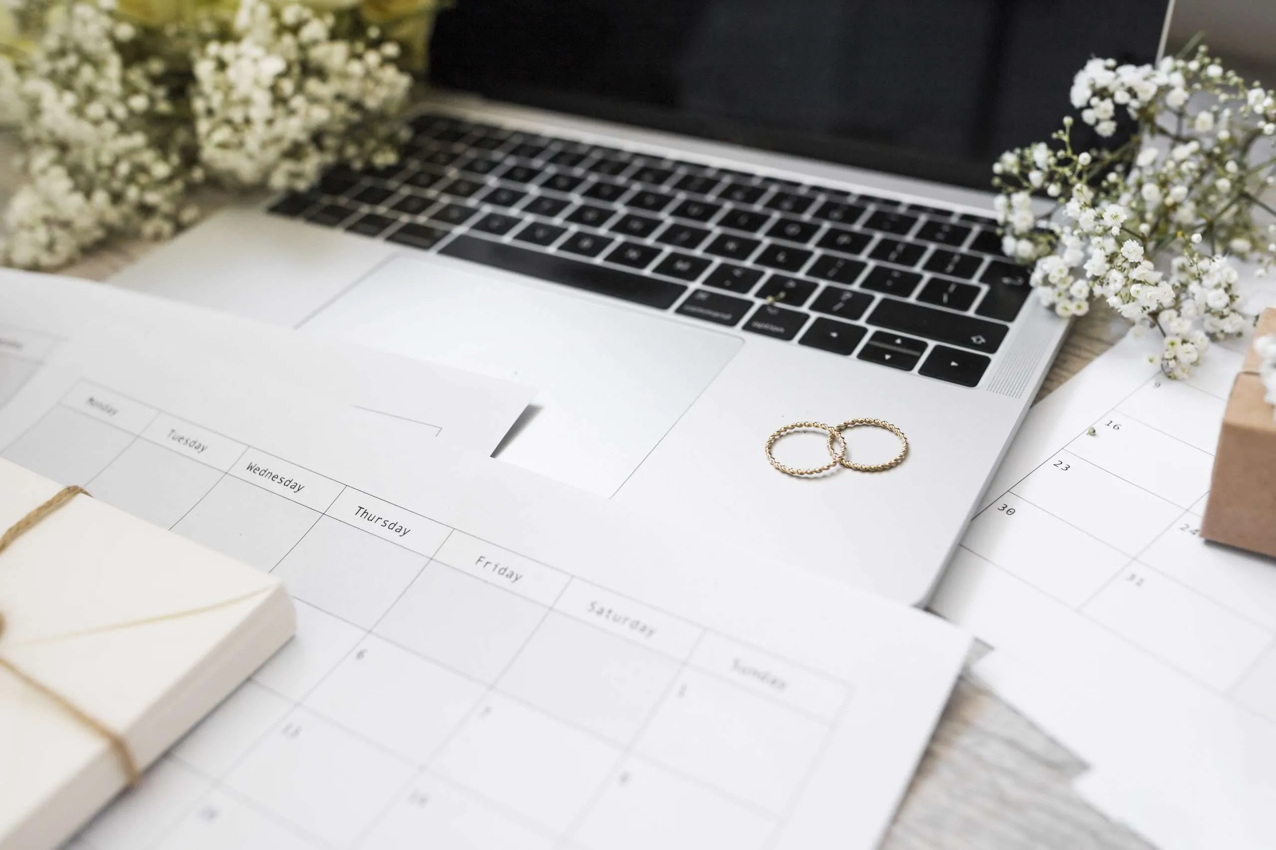 Planning an event timeline with a notebook and a phone on the table